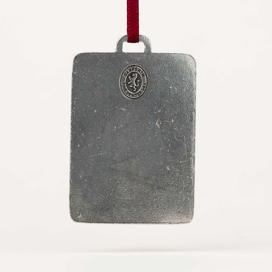 Rectangular metal ornament with a red ribbon on a white background
