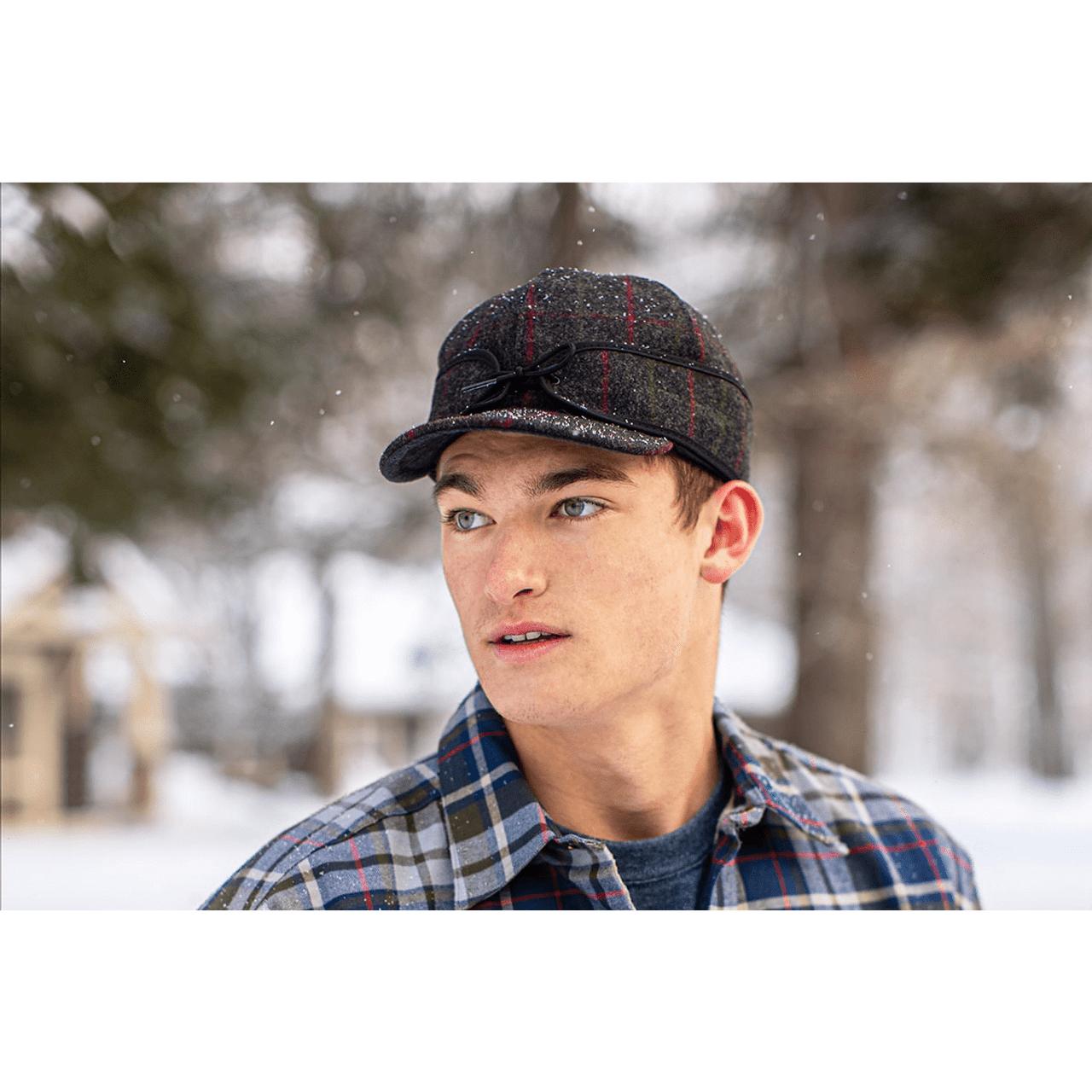 Model wearing Side View of Stormy Kromer Original Gray plaid wool hat