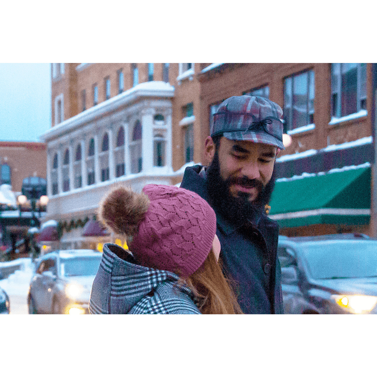 Model wearing Stormy Kromer Mackinaw North Star Plaid wool hat