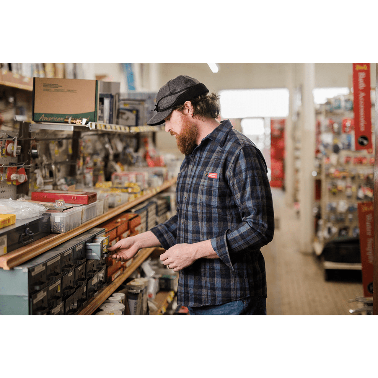 Model wearing Stormy Kromer Rancher gray wool rancher cap in store