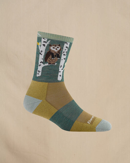 Sock with owl design on a beige background