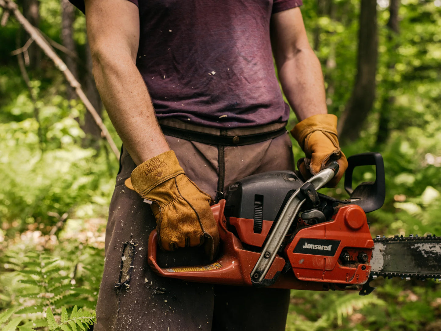 Vermont Glove Vermonter leather glove on model with chainsaw