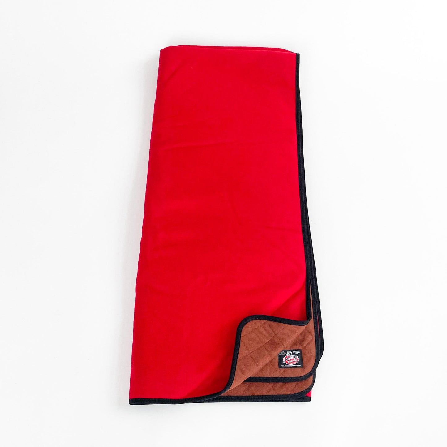 Bright scarlet woolen throw with tan quilted lining