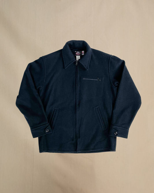 Navy jacket on a beige background