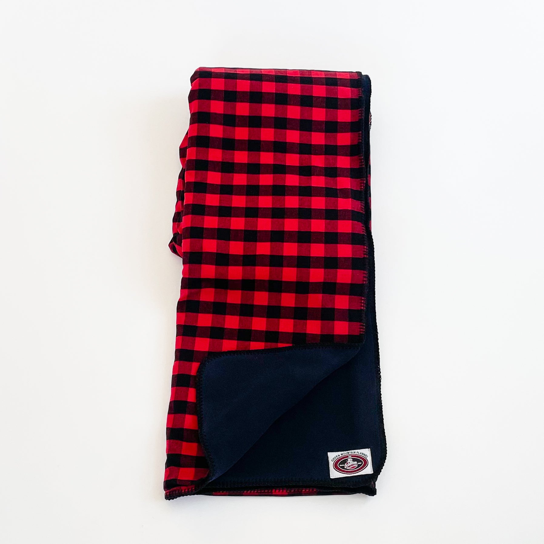 Green Mountain Flannel Throw Red & Black Buffalo squares with black fleece lining open corner view