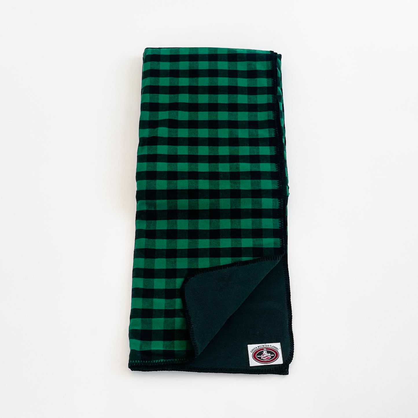 Green Mountain Flannel Throw Green & Black 1 inch buffalo squares with black fleece lining open corner view