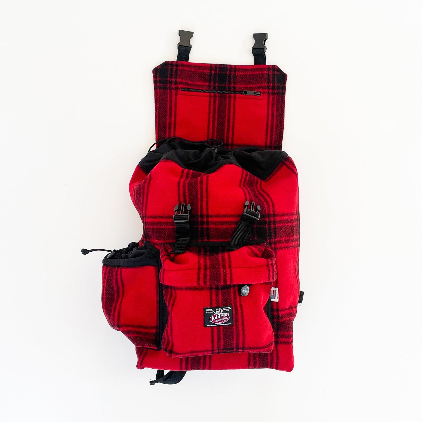 Johnson Woolen Mills Daypack Bright Red & Black Muted Plaid front view with water bottle in side pocket and top flap open