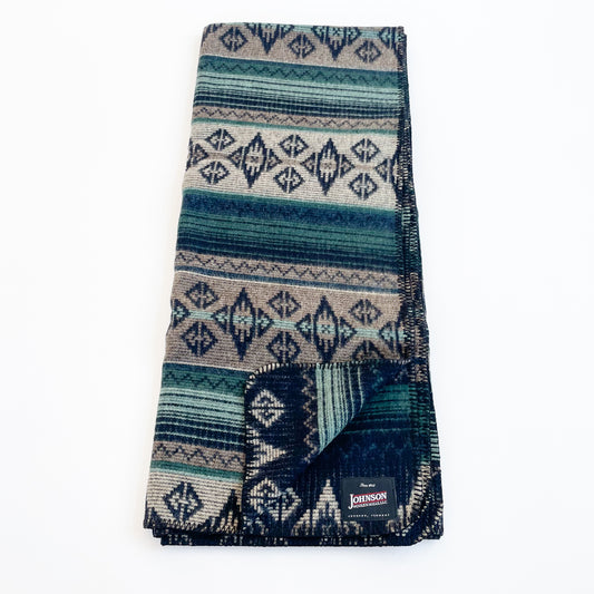 Johnson Woolen Mills Summer Shade Teal Taupe Navy Print folded blanket length wise with logo patch