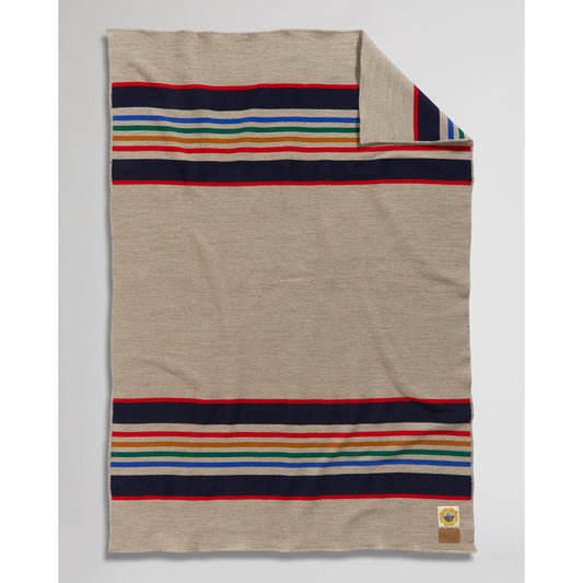 Pendleton Blanket, yellow stone , light gray background, with blue/green/red/black stripes folded view