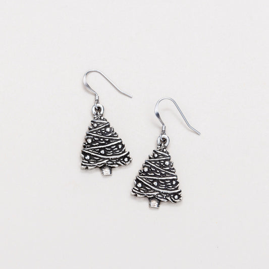 A pair of silver-colored Christmas tree wire earrings on a white background.