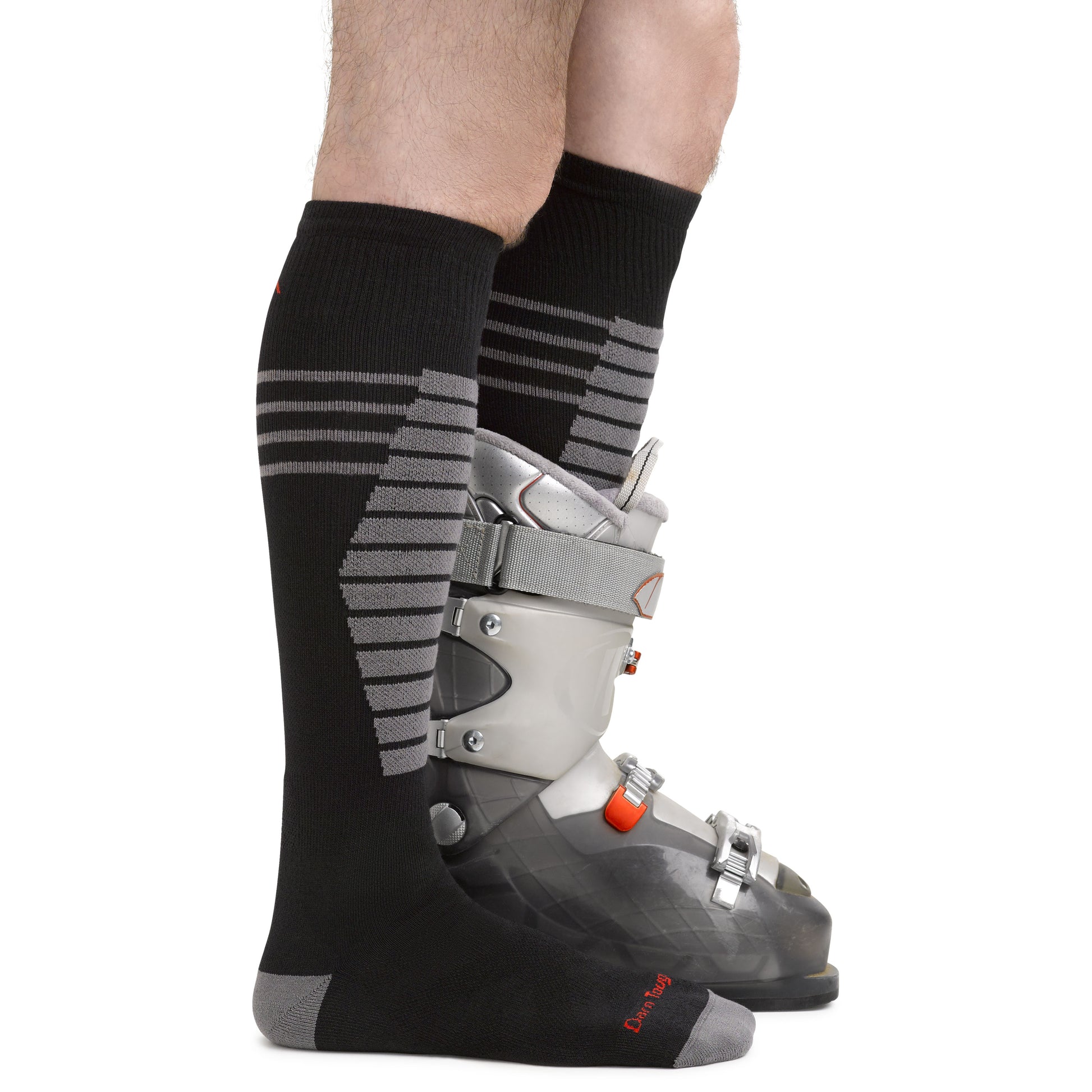 Darn Tough Men's Black Thermolite Edge Over-the-Calf Midweight Ski & Snowboard Sock on model in ski boot