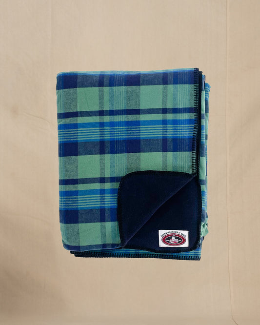 Green Mountain Flannel Throw Royal Navy & Green stripes with black fleece lining open corner view
