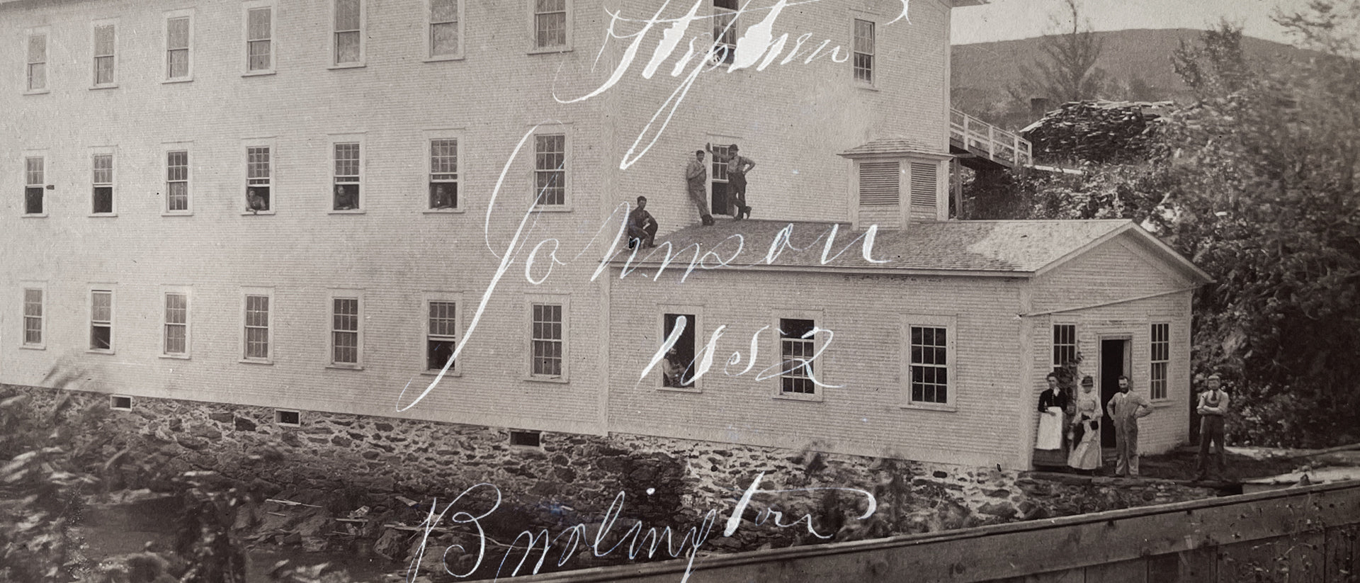 Historical black and white photograph of the Johnson Mill with text overlay