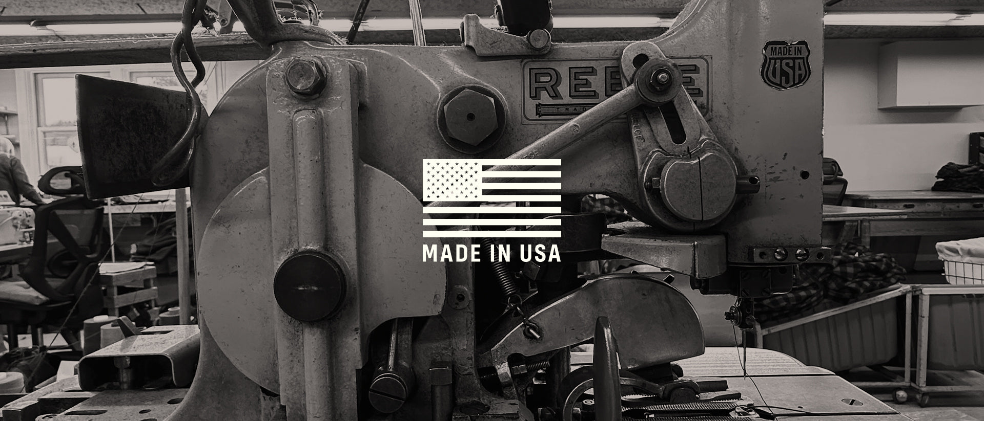 Industrial sewing machine with 'Made in USA' logo overlay in a workshop setting
