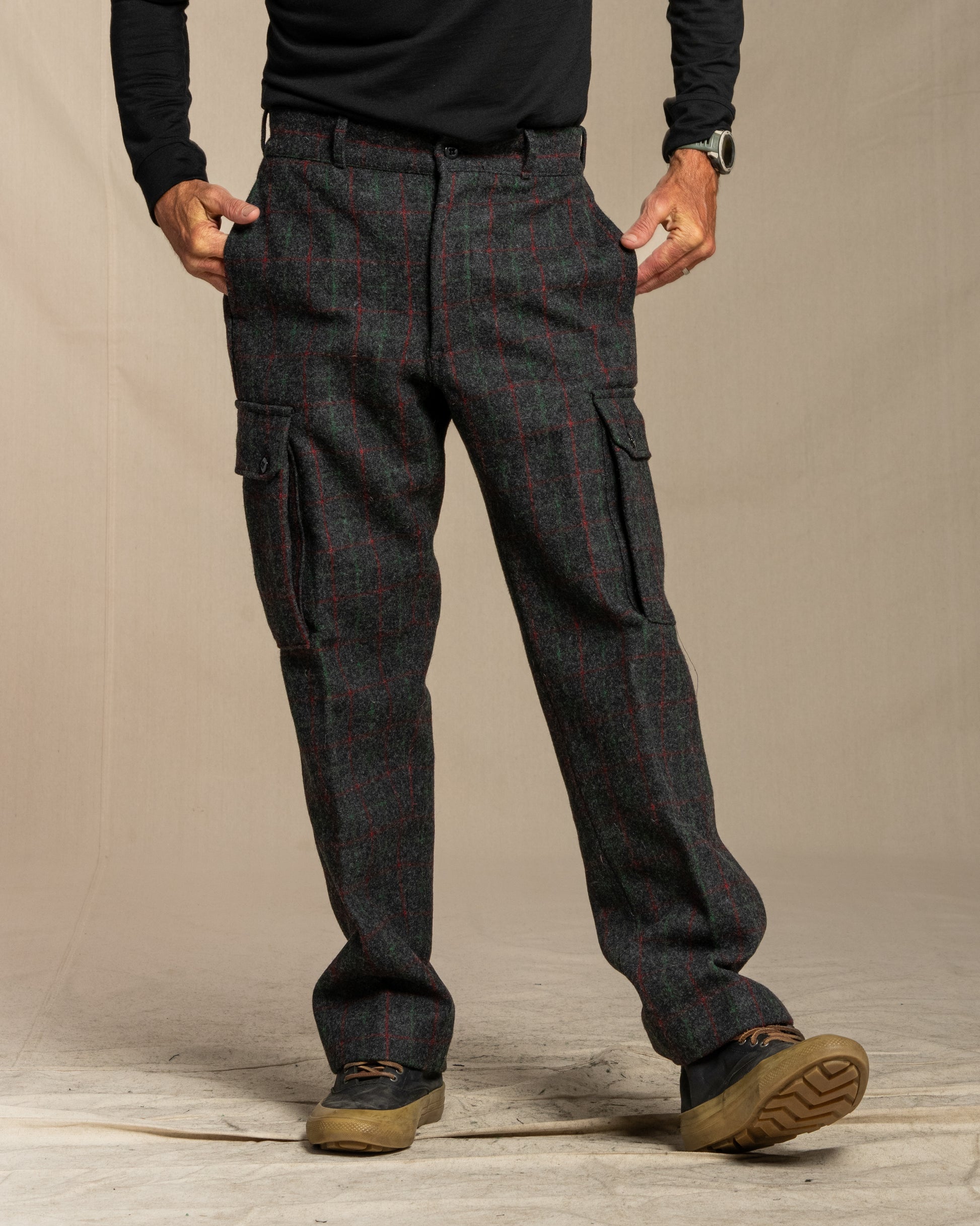 Person wearing Adirondack plaid cargo pants on a canvas background