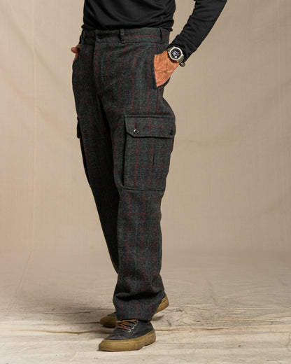 Person wearing Adirondack plaid cargo pants on a canvas background