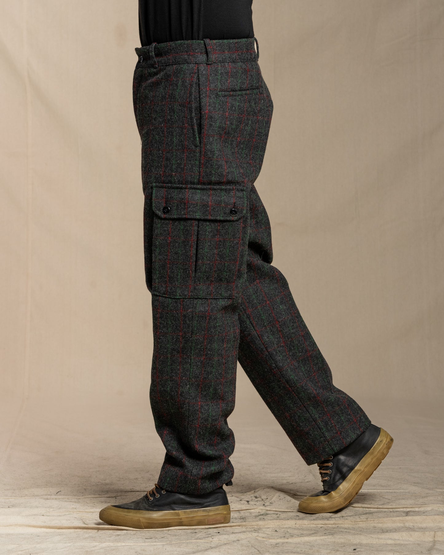 Person wearing Adirondack plaid cargo pants on a canvas background