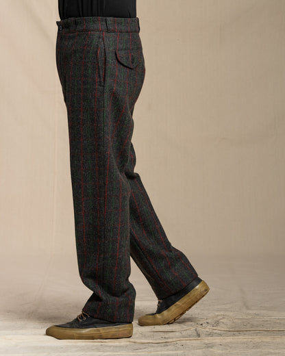 Person wearing Adirondack plaid pants against a beige background