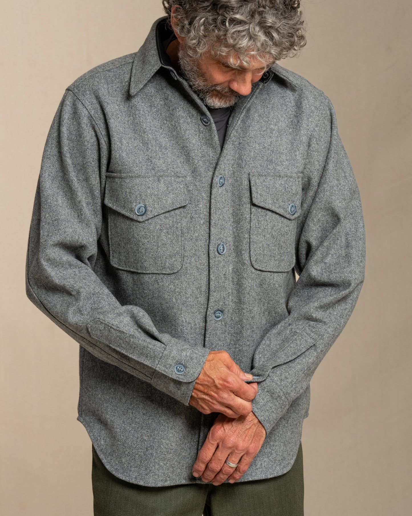 Gray wool button down shirt on man