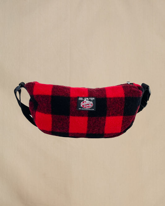 Wool sidewinder bag with strap - bag with zipped closure and belt loops for wearing on your waist plus shoulder strap. Shown in red and black buffalo plaid