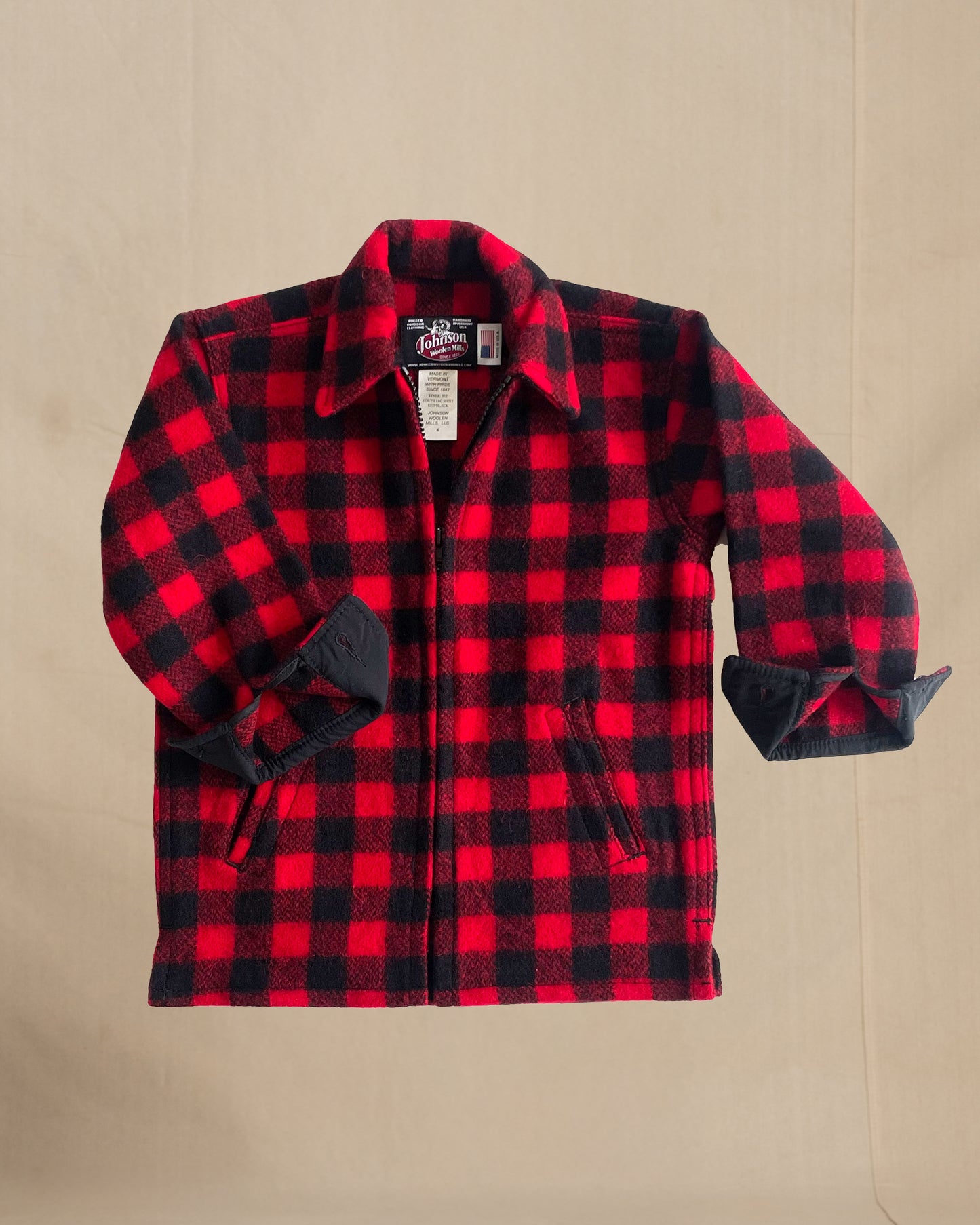 Children's Red and black checkered shirt on a beige background
