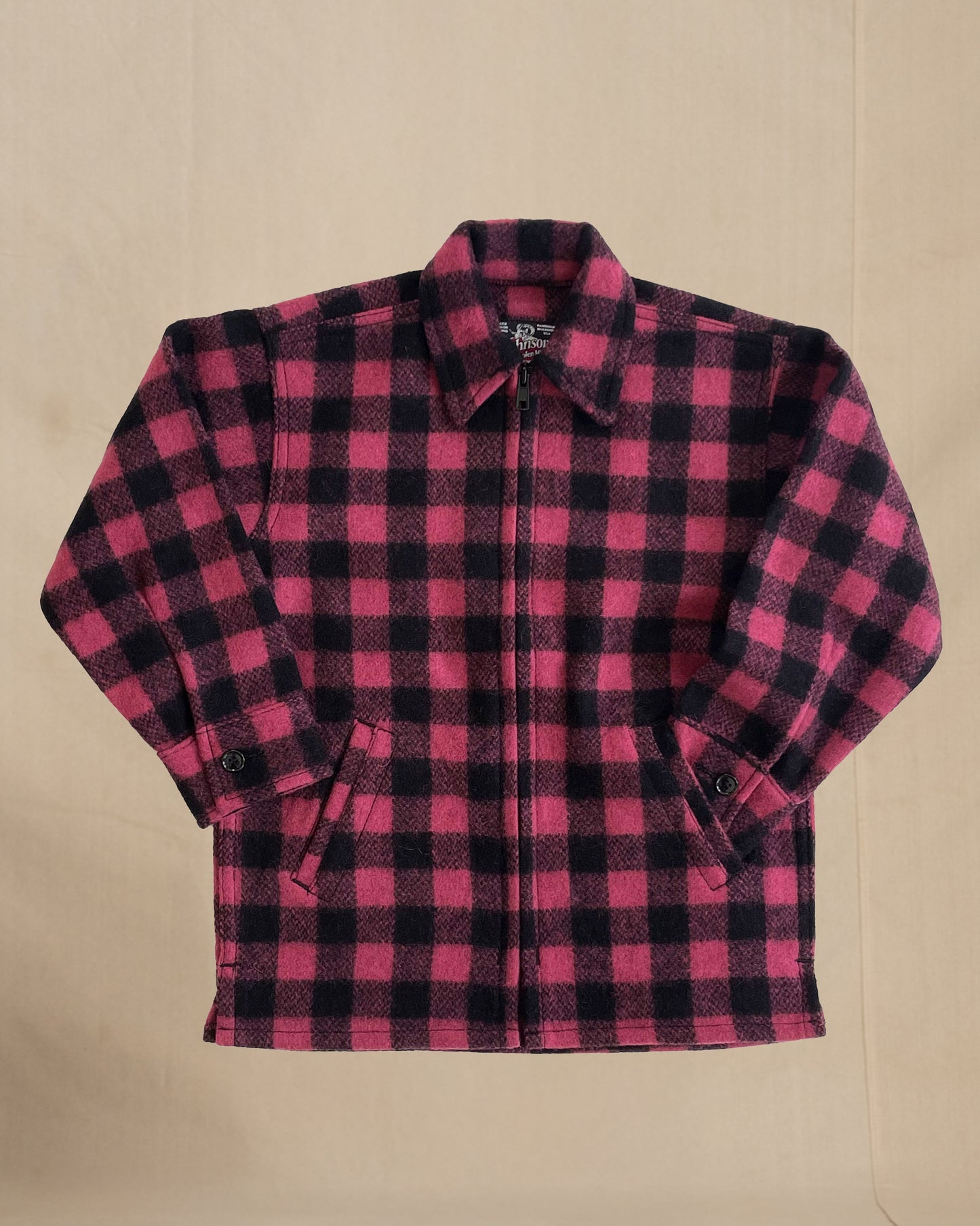 Children's Pink and black checkered shirt on a beige background