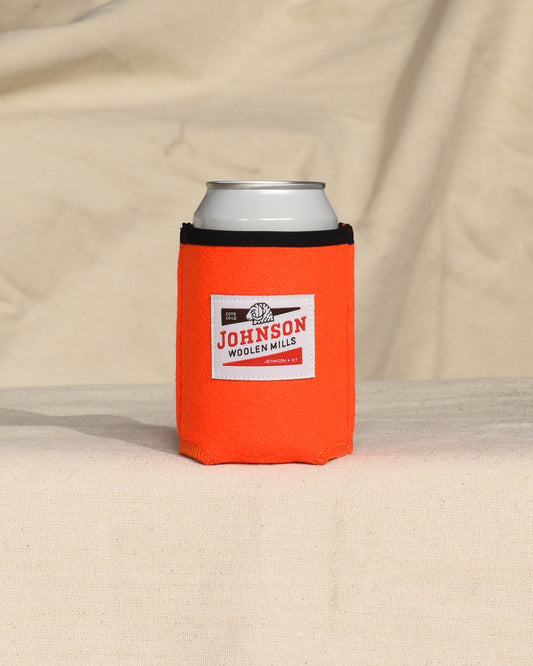 Blaze Orange wool can cooler with Johnson logo on a beige surface