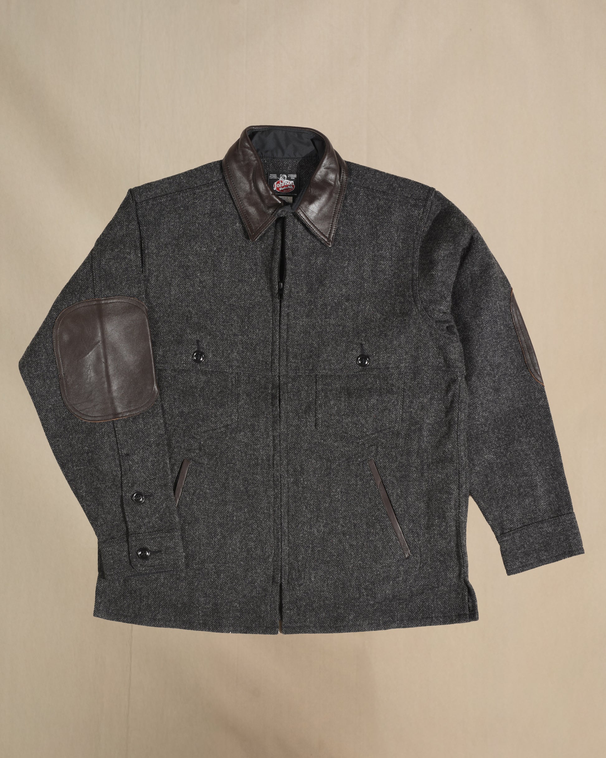 Gray Herringbone jac shirt with leather collar, elbow, and pocket detail.  Front view