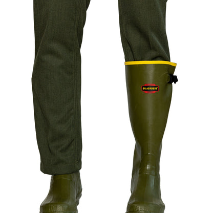 Northwoods 1842 wool green pants closeup of leg, one pantleg tucked in green rubber boot