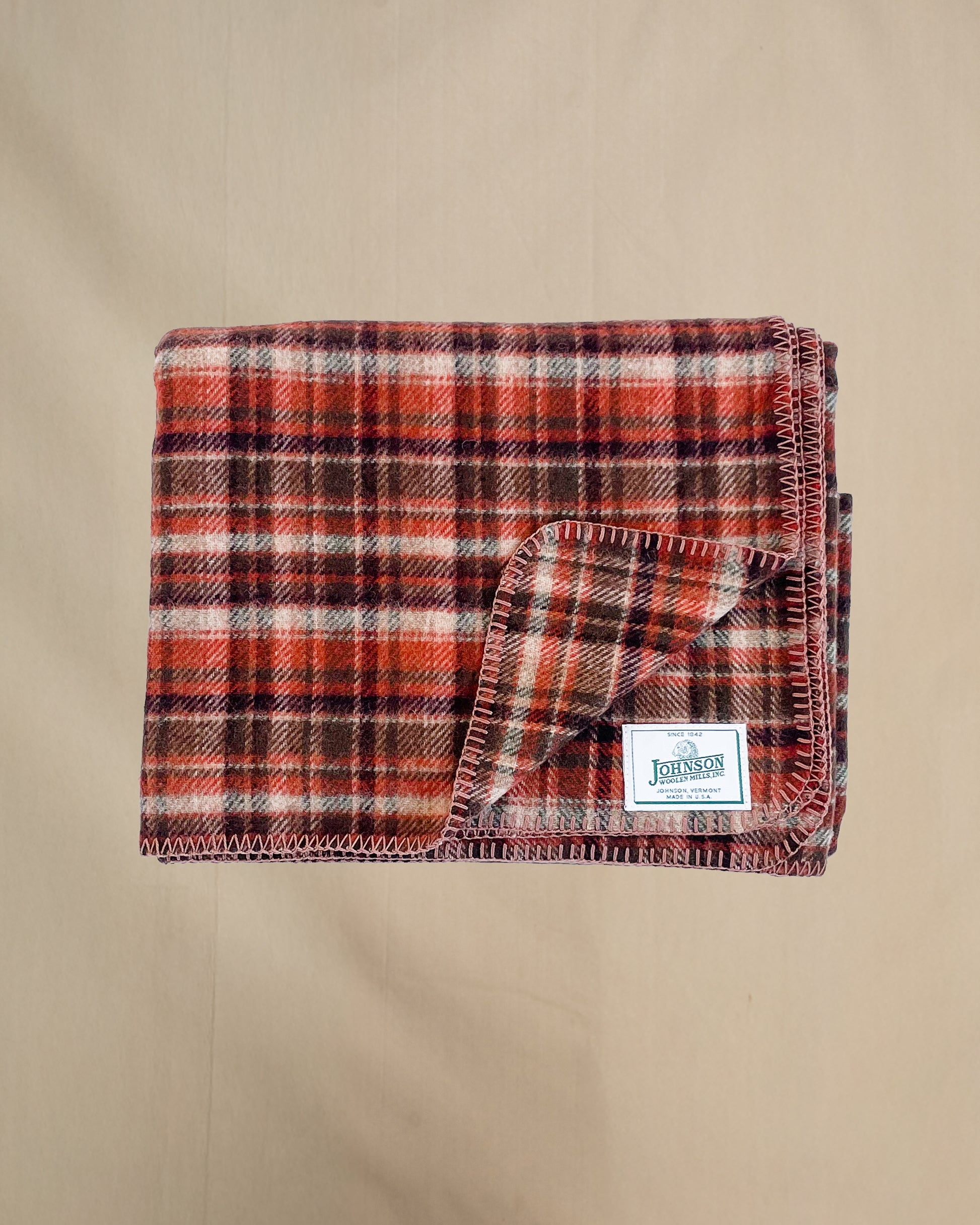 Johnson Woolen Mills Rust Tan Brown Plaid folded blanket front view 