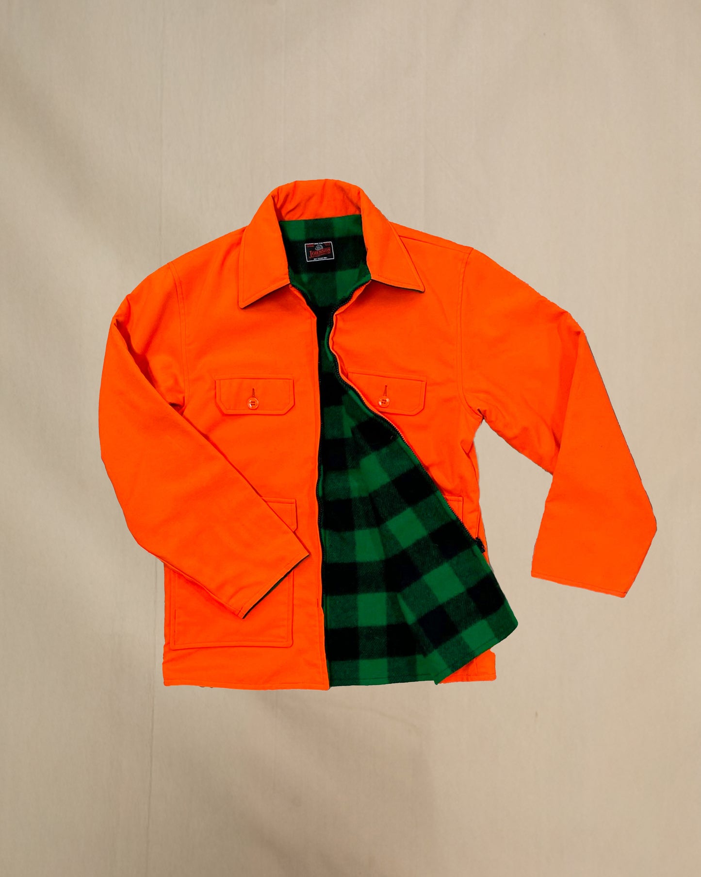 Johnson Woolen Mills blaze orange reversible jacket with green and black check interior view