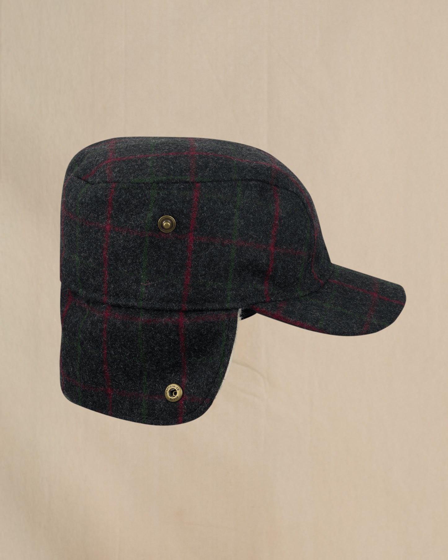 Stormy Kromer Adirondack Plaid Bergland Cap side view with ear flap down 