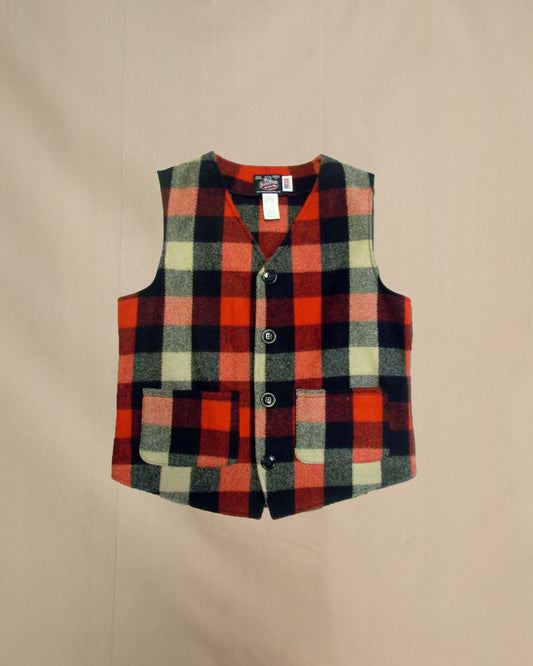 Plaid vest with buttons on a beige background