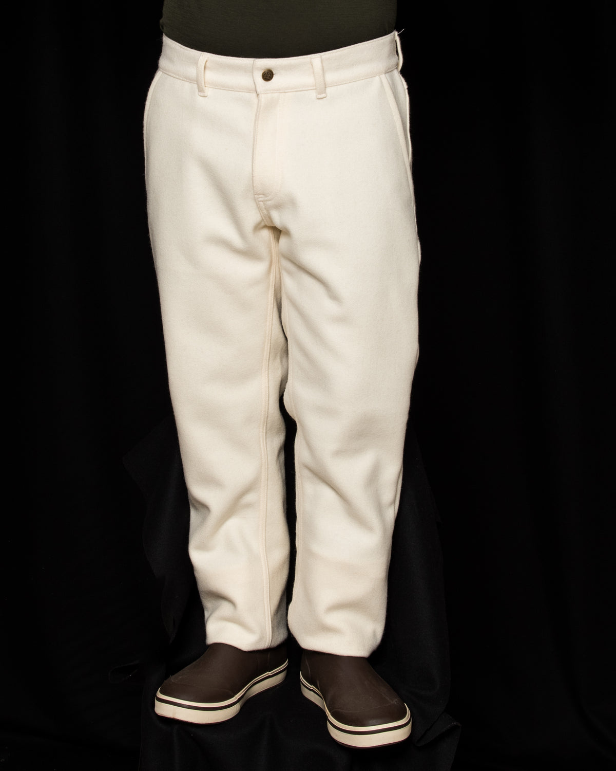 White-out Tracker Pants 100% White wool on model wearing brown boots