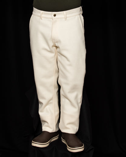 White-out Tracker Pants 100% White wool on model wearing brown boots