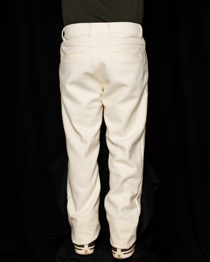 Back side of White-out Tracker Pants 100% White wool on model wearing brown boots