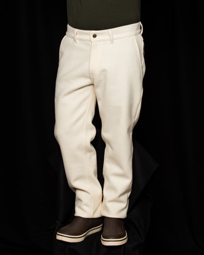 White-out Tracker Pants 100% White wool on model wearing brown boots