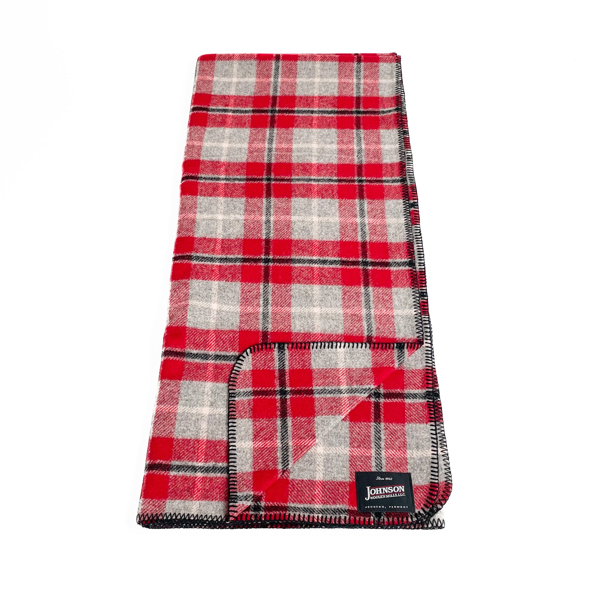Red gray and black plaid norris wool throw blanket laid vertically 