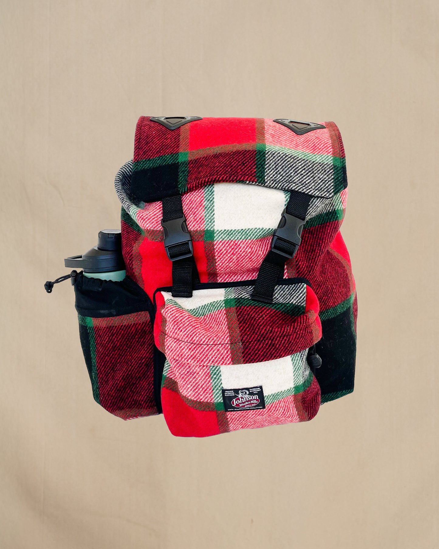 Johnson Woolen Mills Daypack Canadian Plaid Red/Pink/Green/White/ front view with water bottle in side pocket