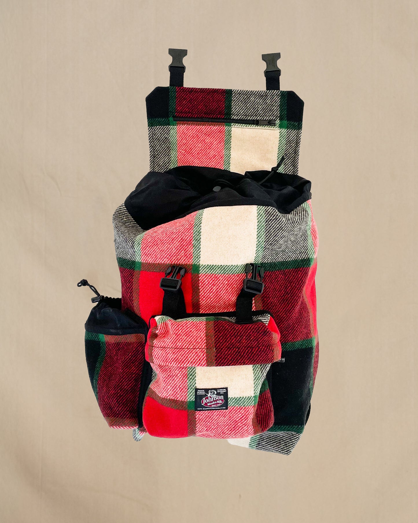 Johnson Woolen Mills Daypack Canadian Plaid Red/Pink/Green/White/ front view  with water bottle in side pocket
