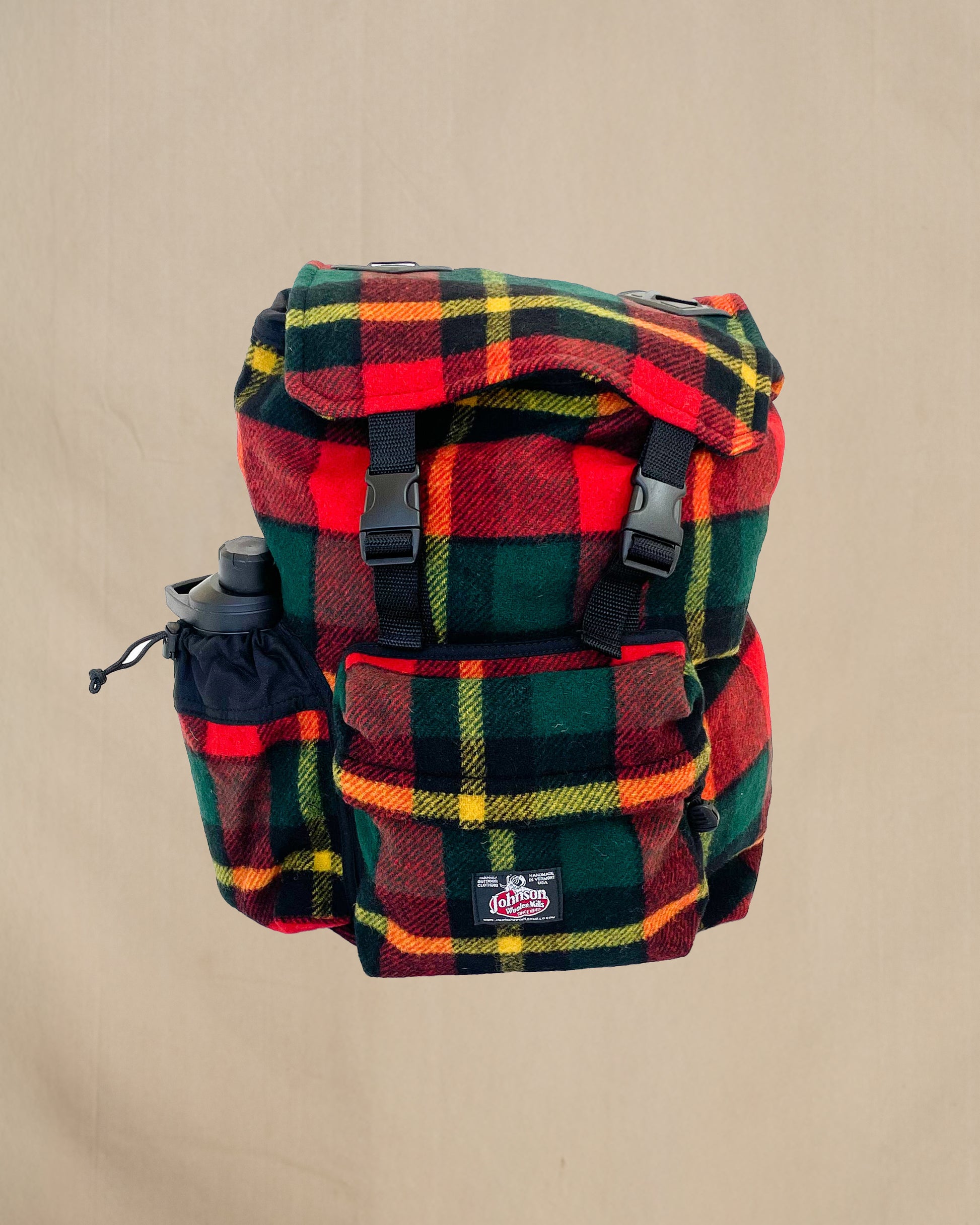 Johnson Woolen Mills Daypack Bright Red/Green/Yellow front view with water bottle in side pocket