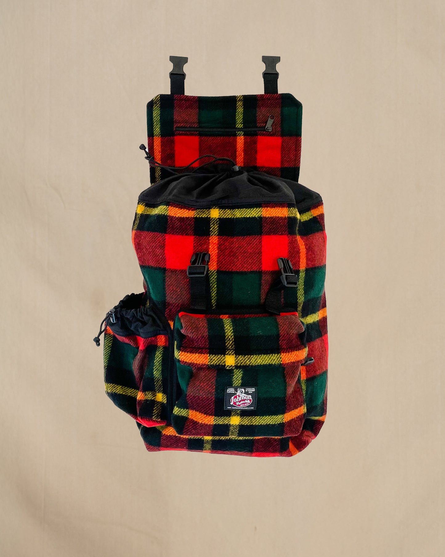 Johnson Woolen Mills Daypack Bright Red/Green/Yellow front view with water bottle in side pocket and top flap open