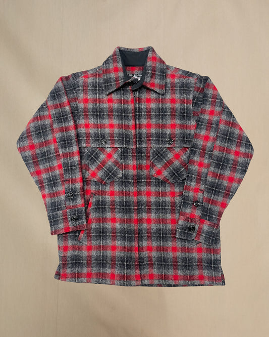 Plaid shirt with red and gray pattern on a beige background