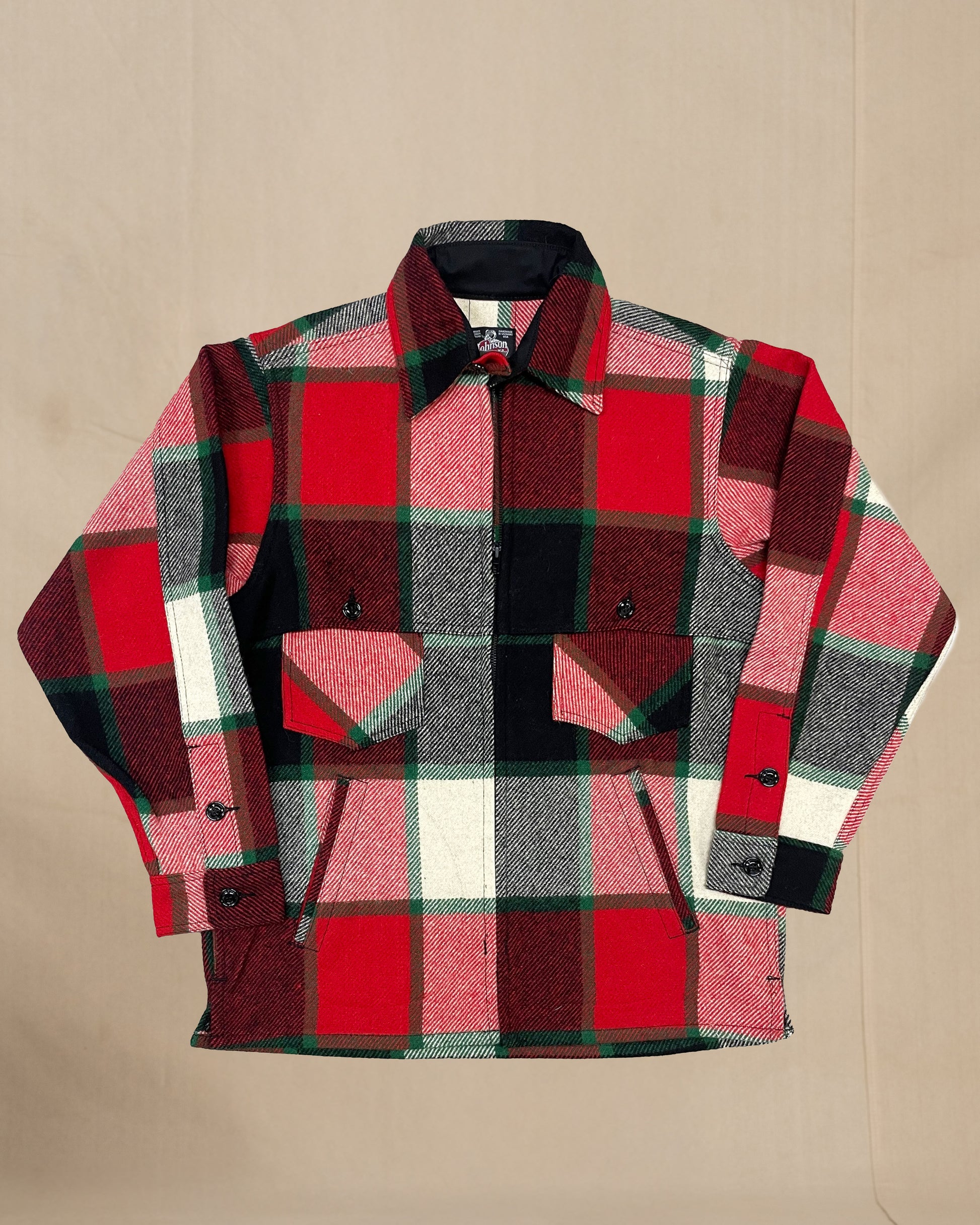 Wool jac shirt with full zipper, two chest pockets and two lower slash pockets. Shown in old Canadian plaid