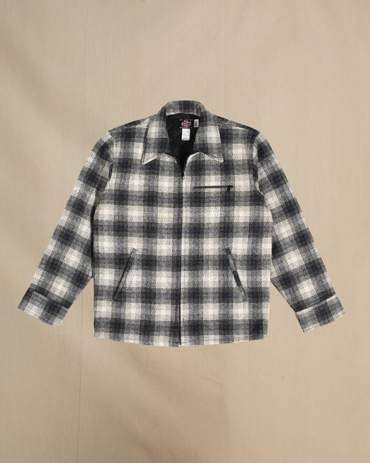 Plaid jacket with black and white pattern on a beige background