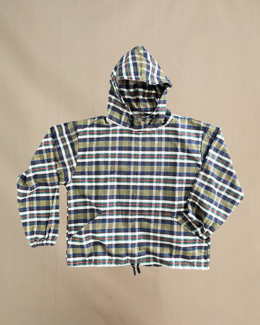 Plaid flannel hoodie on a beige background