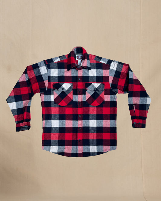 Plaid shirt with red, black, and white pattern on a beige background
