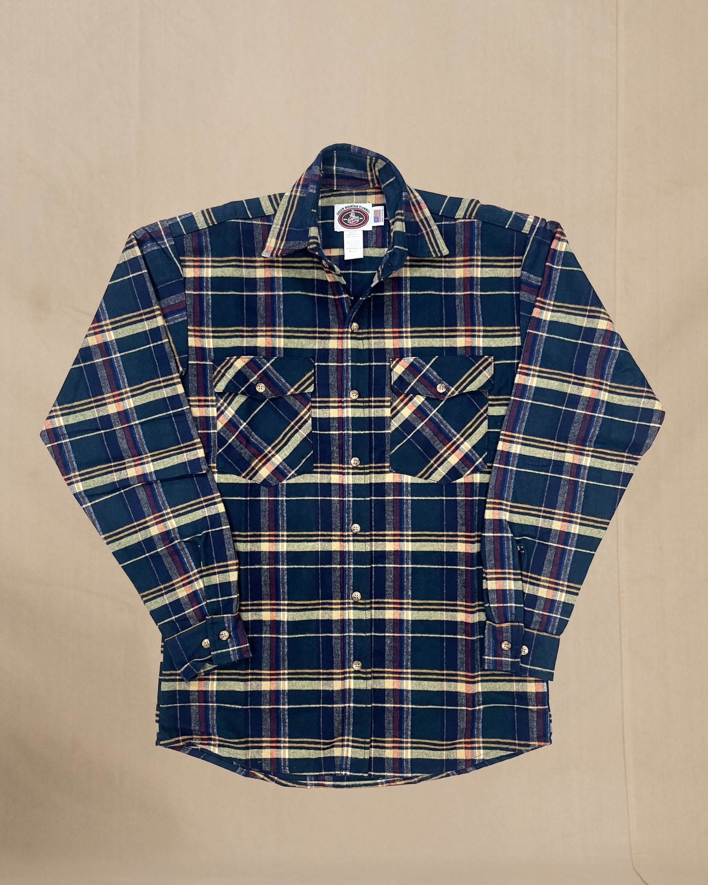 Plaid shirt with a visible Johnson label on a beige background