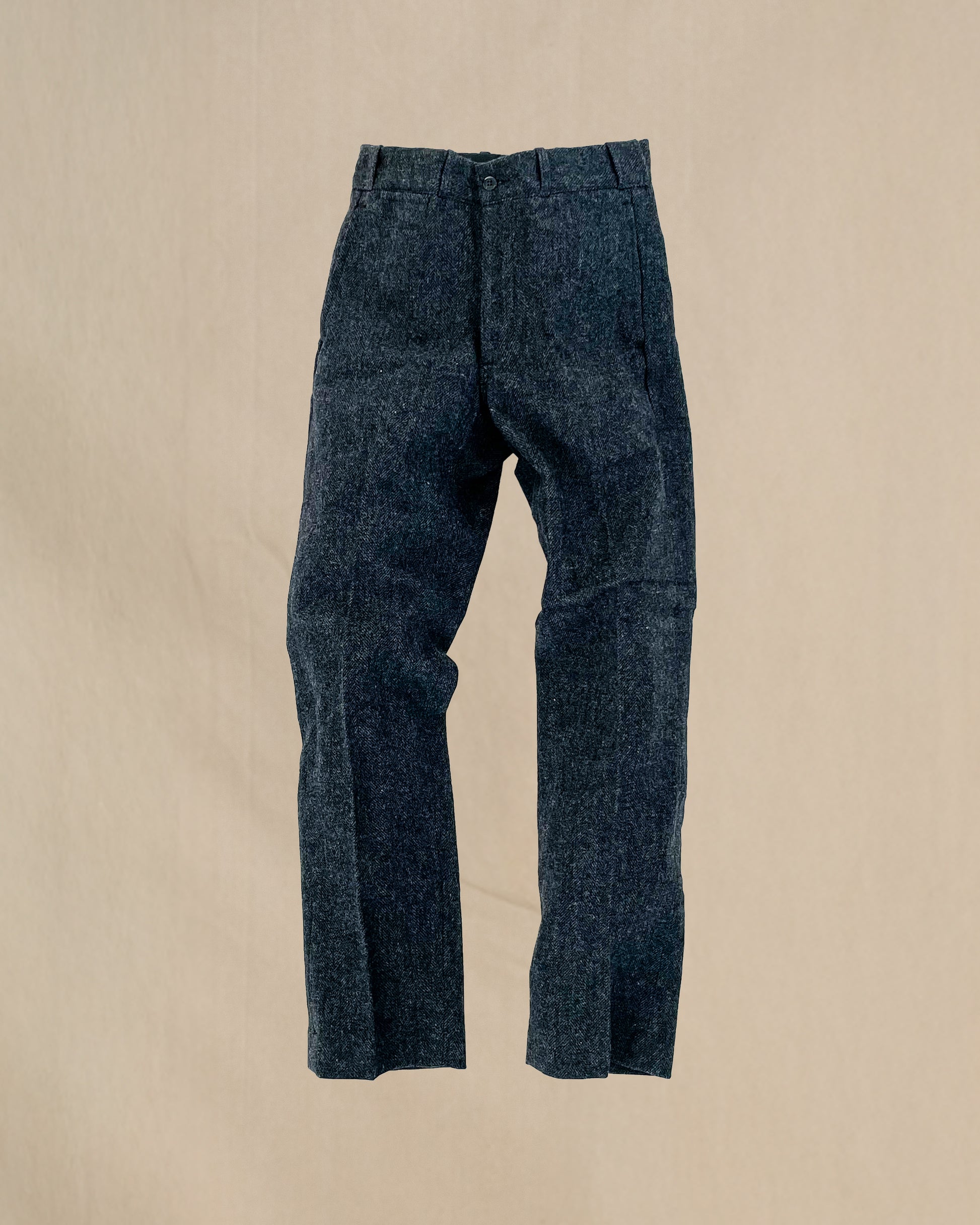 Herringbone gray pants on a beige background