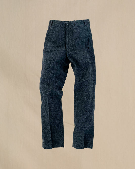 Herringbone gray pants on a beige background